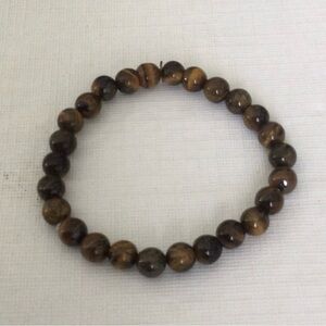 Woman’s Cats Eye Polished Beaded color brown stretch elastic